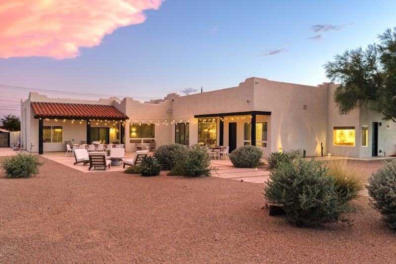 The house at dusk with the string lights on