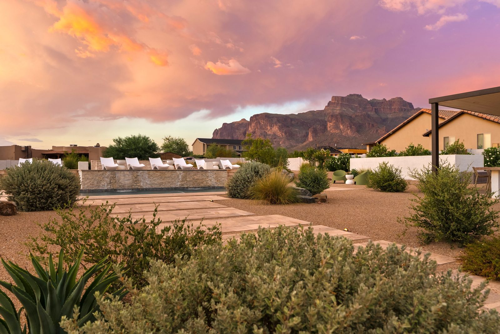 The pool at La Serena at twilight with the Superstition Mountains behind it